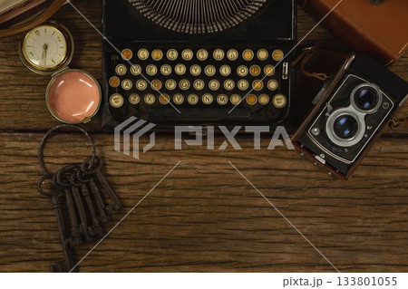 Typewriter, camera and clock on table Typewriter, camera and clock on table 133801055