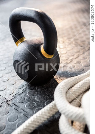 High angle view of kettlebell and rope 133802574