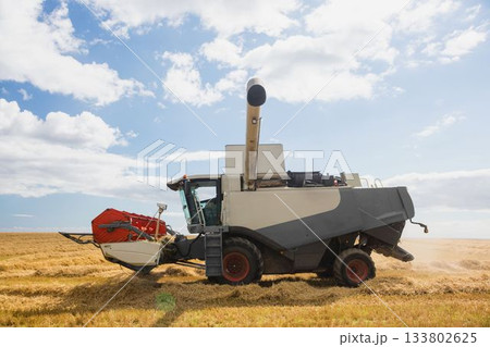 View of a harvester on a field 133802625