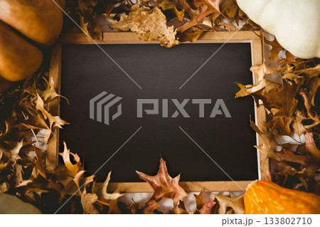 Black screen surrounded by brown leaf 133802710