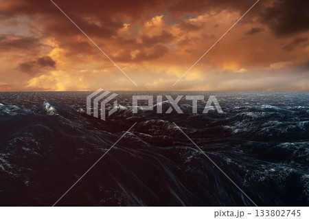Flat vector illustration is showing rolling ocean waves under glowing amber clouds at horizon line 133802745