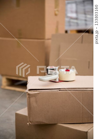 Packaging equipment on cardboard box 133803160