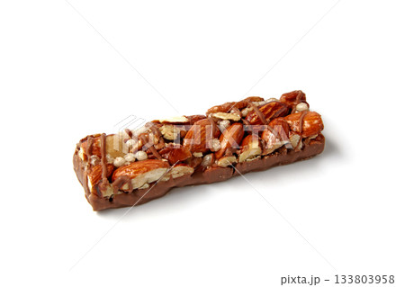 sweet caramel nut bars with chocolate isolated on white background. sweet caramel nut bars with chocolate isolated on white background. 133803958
