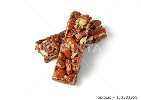 Two sweet caramel nut bars isolated on white background. 133803959