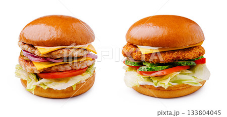 Delicious chicken and beef burgers stacked high with fresh toppings Delicious chicken and beef burgers stacked high with fresh toppings 133804045