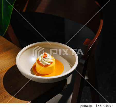 Delicious dessert served in a cozy restaurant with warm lighting Delicious dessert served in a cozy restaurant with warm lighting 133804051