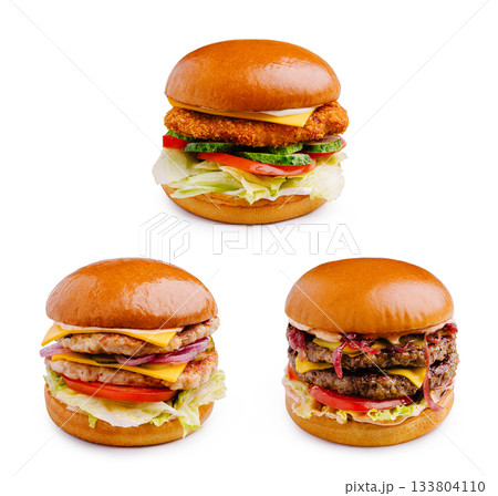 Delicious burgers with various toppings presented on a white background 133804110
