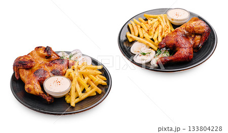 Delicious grilled chicken served with golden fries and dipping sauce 133804228