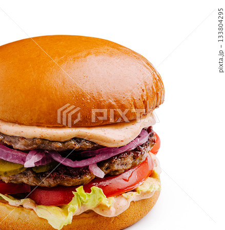 Juicy hamburger stacked with patties, fresh vegetables, and special sauce 133804295