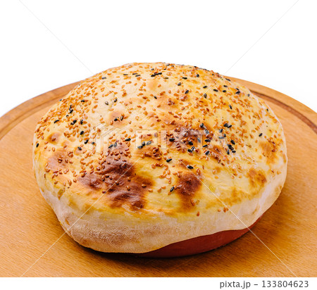 Homemade bread with sesame and poppy seeds baked on wooden board Homemade bread with sesame and poppy seeds baked on wooden board 133804623