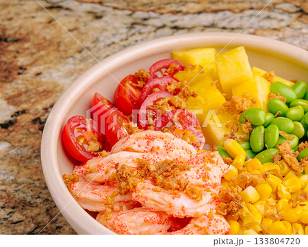 Vibrant seafood salad with shrimp, pineapple, and veggies on granite Vibrant seafood salad with shrimp, pineapple, and veggies on granite 133804720