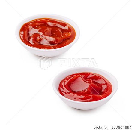 Many bowls of ketchup on a white background look appetizing and fresh Many bowls of ketchup on a white background look appetizing and fresh 133804894