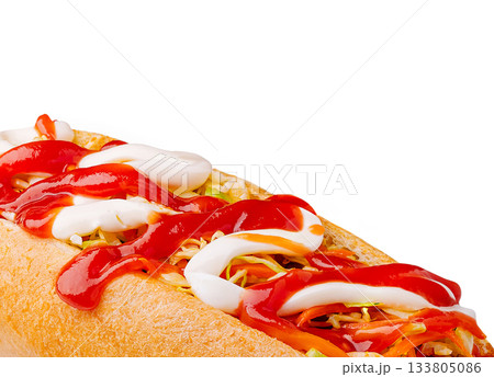 Hot dog topped with ketchup and mayonnaise on a fresh bun 133805086