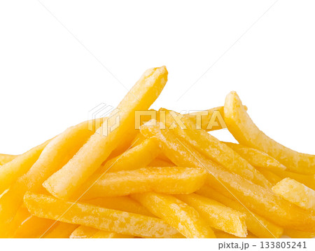 Golden French fries piled high on a white background Golden French fries piled high on a white background 133805241
