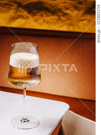 Refreshing drink served in a stylish glass on a modern table Refreshing drink served in a stylish glass on a modern table 133805258