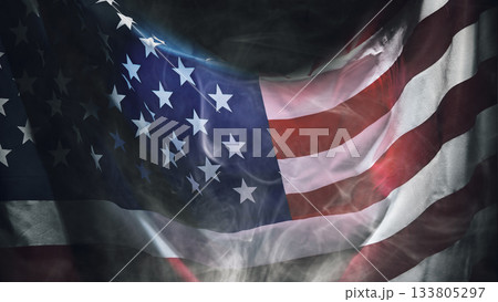 Closeup view of the American flag waving with a dark background. Copy space. American holiday backdrop 133805297