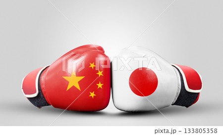 Two boxing gloves with China and Japan national flags facing each other. Conflict between China against Japan Two boxing gloves with China and Japan national flags facing each other. Conflict between China against Japan 133805358