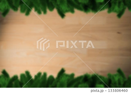 Blurred fir tree branches on wood Blurred fir tree branches on wood 133806460