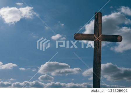 Wooden cross is standing against open sky with natural rope and cumulus clouds in flat design Wooden cross is standing against open sky with natural rope and cumulus clouds in flat design 133806601