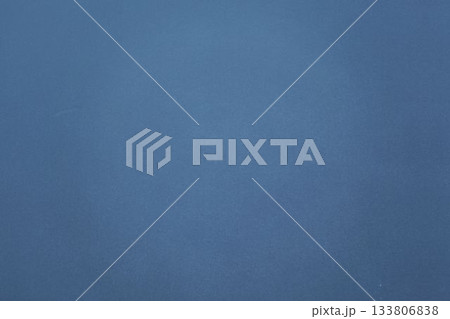 Uniform blue textured surface is filling full frame in flat design and creating abstract backdrop 133806838