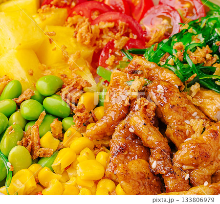 Delicious colorful salad bowl with fresh ingredients and grilled chicken Delicious colorful salad bowl with fresh ingredients and grilled chicken 133806979