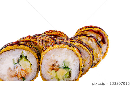 Delicious sushi rolls with crispy coating and savory sauce on display 133807016