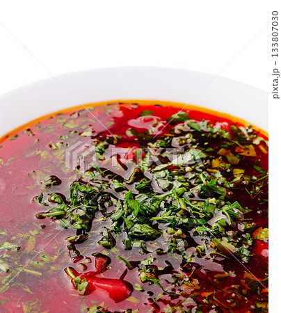Delicious rich red soup with herbs and spices ready to enjoy 133807030