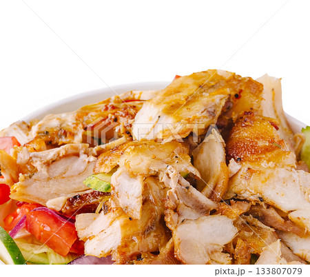 Savory grilled chicken salad with fresh vegetables and crispy toppings Savory grilled chicken salad with fresh vegetables and crispy toppings 133807079