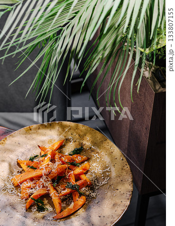 Freshly prepared roasted batata served on a rustic plate Freshly prepared roasted batata served on a rustic plate 133807155