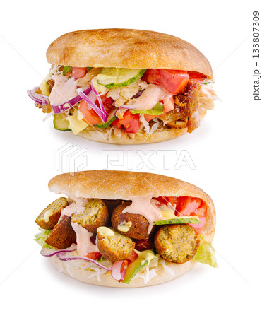 Savory sandwich options featuring fried chicken and falafel in pita Savory sandwich options featuring fried chicken and falafel in pita 133807309