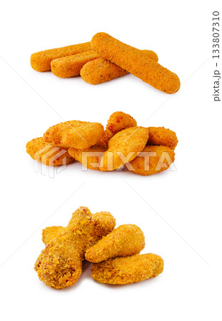 Crunchy fried snacks arranged in three layers on a white background Crunchy fried snacks arranged in three layers on a white background 133807310