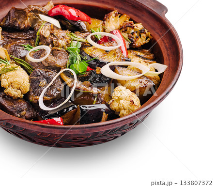 Delicious meat and vegetable dish served in a traditional clay pot 133807372