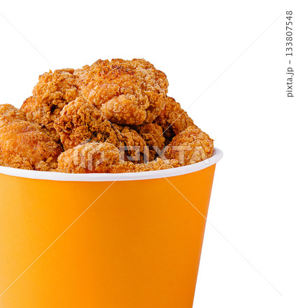 Crispy fried chicken in a bright orange container ready for serving 133807548