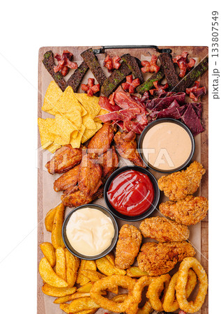 Delicious platter of appetizers with dips at a casual gathering 133807549