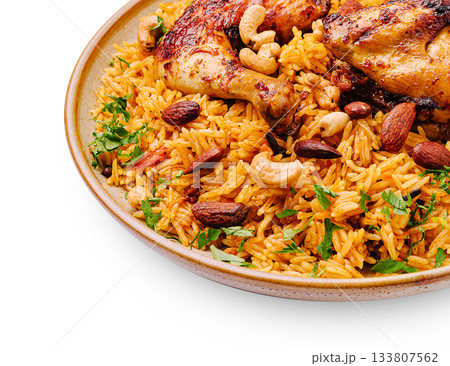 Delicious chicken and rice dish with nuts and herbs served in a bowl 133807562