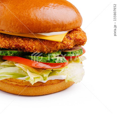 Crispy chicken sandwich with fresh vegetables and cheese on a toasted bun 133807652