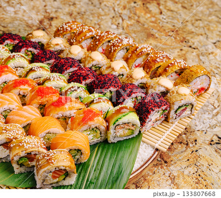 Colorful platter of sushi rolls showcases variety at a gourmet restaurant 133807668