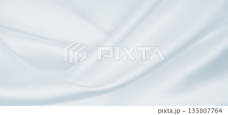 Smooth elegant grey silk or satin luxury cloth as wedding background. Luxurious background design Smooth elegant grey silk or satin luxury cloth as wedding background. Luxurious background design 133807764