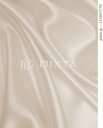 Smooth elegant golden silk or satin luxury cloth texture as wedding background. Luxurious background design. In Sepia toned. Retro style Smooth elegant golden silk or satin luxury cloth texture as wedding background. Luxurious background design. In Sepia toned. Retro style 133807770