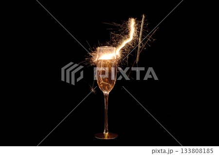 Champagne Glass with Sparkler Explosion on Black Background 133808185