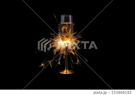 Champagne Glass with Sparkler Explosion on Black Background 133808192