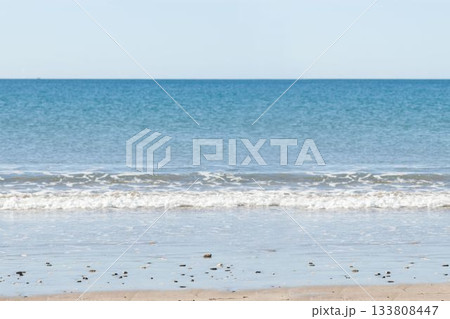 A picture of a beach with a sea background 133808447