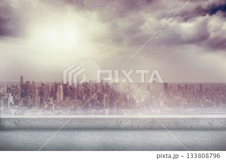 Flat design featuring concrete terrace overlooking skyline with sun rays streaming through clouds 133808796