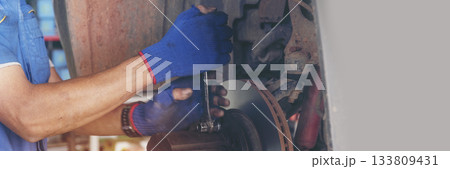 Banner Man hands fixing Car machinery vehicle mechanical service. Mechanic man hands repairing car shop. panoramaopen vehicle hood checking up auto mobile. Car maintenance engineer with copy sapce. 133809431