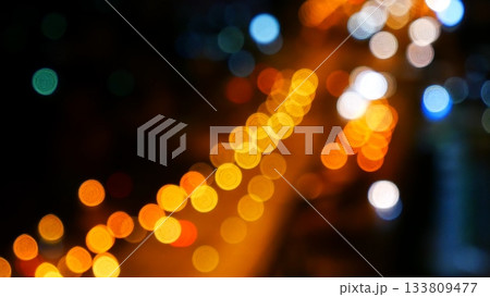 Blurred background night city bokeh car drive on road in nightlife. Light line traffic jam in black night. Blur street flare traffic motion movement. Cityscape Urban dark background twilight time 133809477