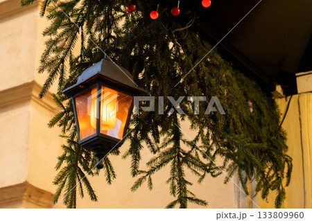 Christmas tree with many ornaments and pine cones. Christmas tree with many ornaments and pine cones. 133809960