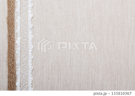 Lace frame on linen cloth background Lace frame on linen cloth background 133810367