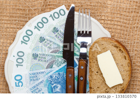 Polish money on kitchen table, cost of living 133810370