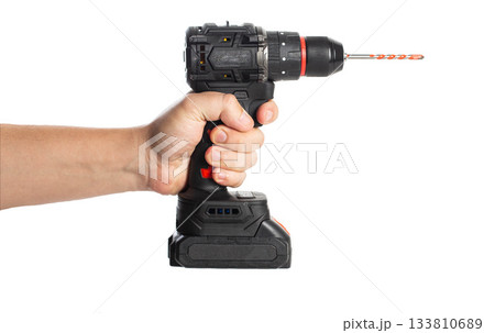 Hand holding a cordless power drill for home improvement projects or repairs, isolate 133810689