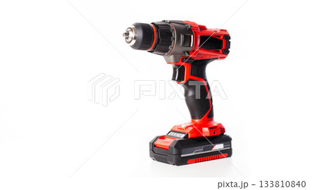 Modern red drill-screwdriver on a white background. Tool for work in industry, isolate 133810840